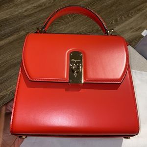 Salvatore Ferragamo coral bag.